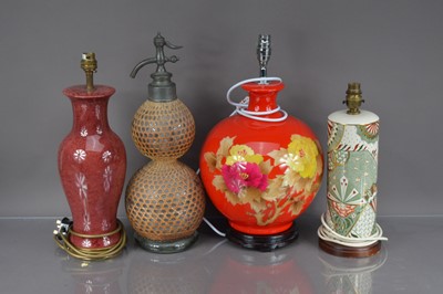 Lot 359 - Three second half 20th century pottery lamp bases and a vintage glass soda syphon