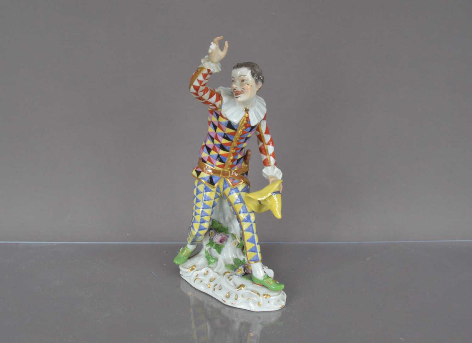 Lot 373 - An early 20th century Meissen porcelain figure of Harlequin