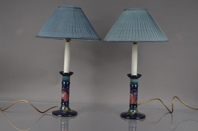 Lot 380 - A pair of Moorcroft Pottery candlestick style lamps