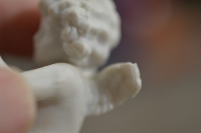 Lot 388 - A collection of German miniature bisque porcelain cherubs