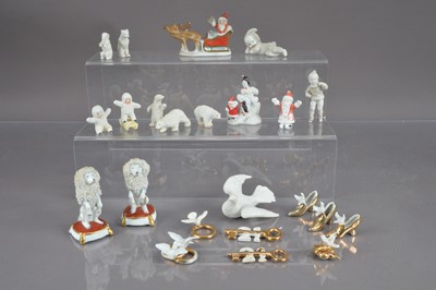 Lot 389 - A quantity of antique and vintage  porcelain  cake decorations, including antique and vintage Christmas cake figures, 21st Birthday and wedding cake decorations and two miniature poodle figurines