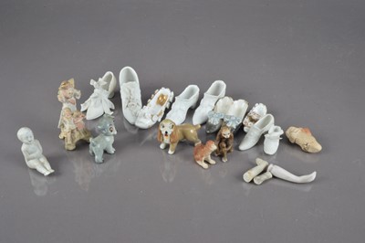 Lot 390 - A quantity of miniature bisque porcelain shoes
