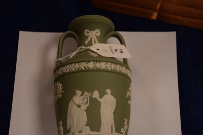 Lot 394 - A Wedgwood green jasperware trophy vase urn