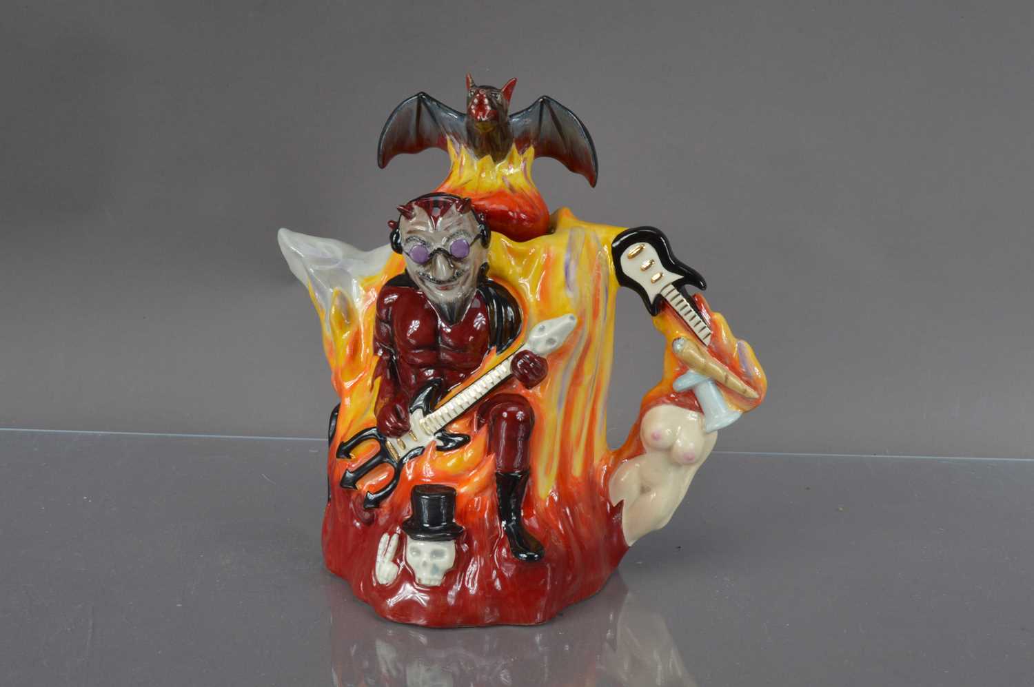 Lot 400 - A novelty "Bat Out of Hell" pottery teapot designed by Vince McDonald for 'Totally Teapots' of Stoke-On-Trent