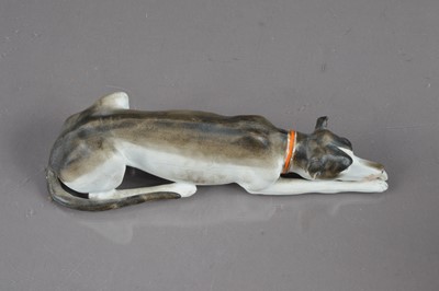 Lot 405 - A late 19th / early 20th Century bisque porcelain whippet or greyhound