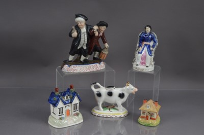 Lot 406 - A group of five Staffordshire pottery figures, pastille burners etc
