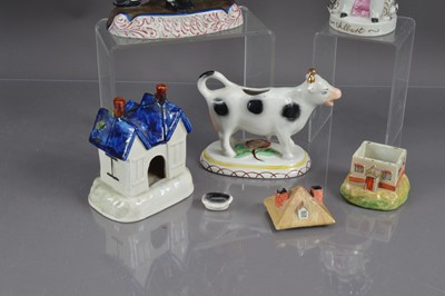 Lot 406 - A group of five Staffordshire pottery figures, pastille burners etc
