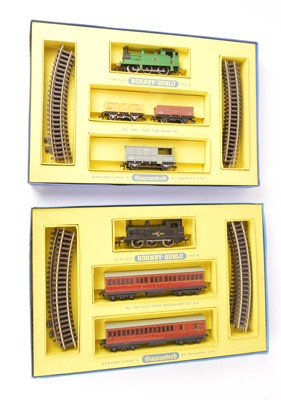 Lot 321 - Hornby-Dublo 00 Gauge 2-Rail  2006 Tank Goods Set and 2009 Tank Passenger Set (2 Sets)