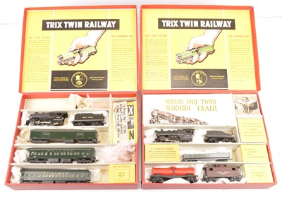 Lot 380 - A pair of Trix (TTR) 00 Gauge 3-rail 14v AC American Freight and Passenger Train Packs (2)