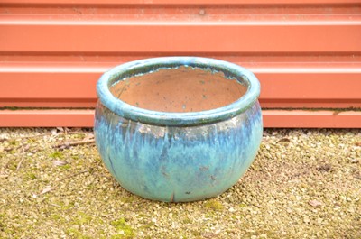 Lot 344 - A blue treacle glazed terracotta plant pot