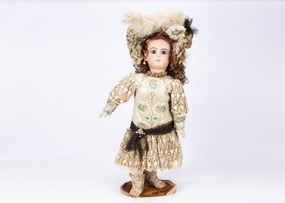 Lot 82 - A reproduction Jumeau bisque headed doll