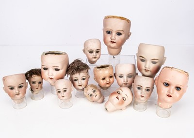 Lot 95 - Fourteen doll heads