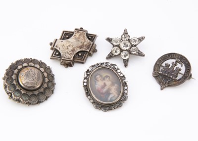 Lot 8 - Five silver and white metal brooches
