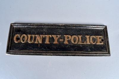 Lot 566 - A vintage County-Police cast iron sign