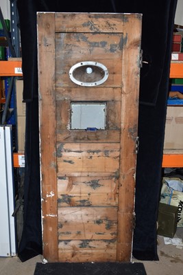 Lot 568 - A pitch pine Cell Door from Louth Police Station
