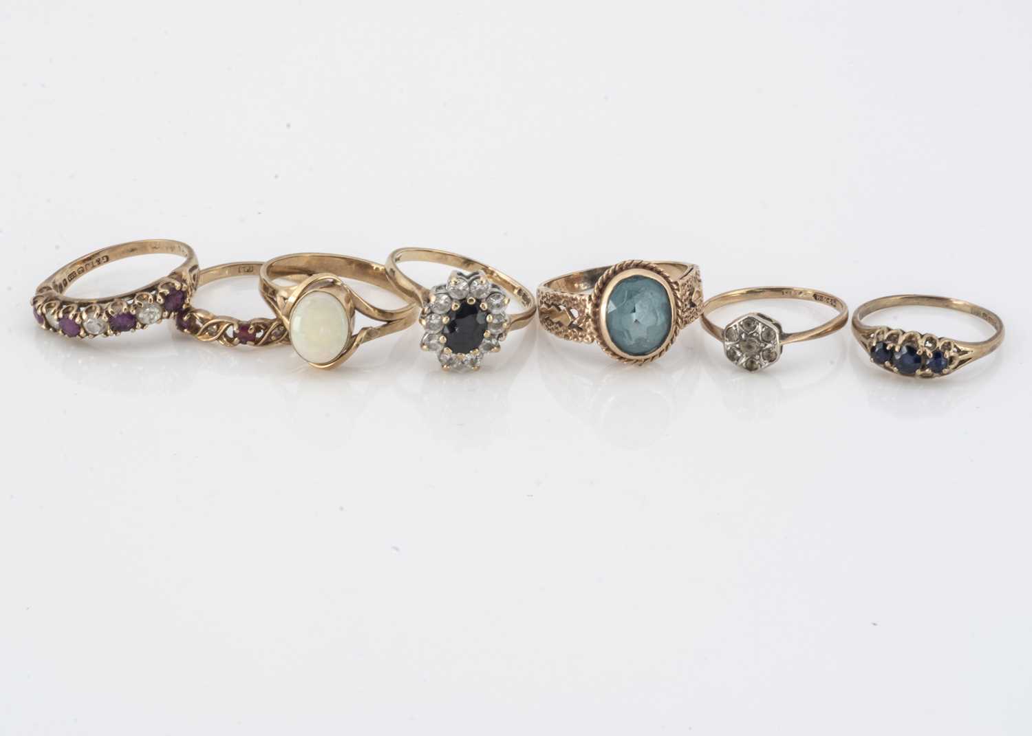 Lot 63 - A collection of seven 9ct gold gem set rings