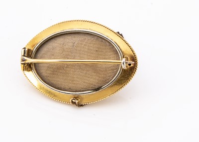 Lot 80 - A Victorian yellow metal oval enamel and seed pearl brooch