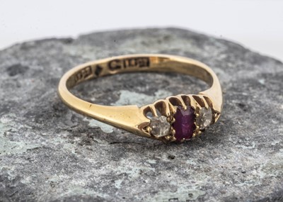 Lot 92 - An 18ct gold three stone ruby and diamond dress ring