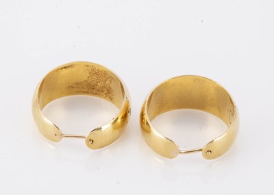 Lot 94 - A pair of yellow metal cuffs