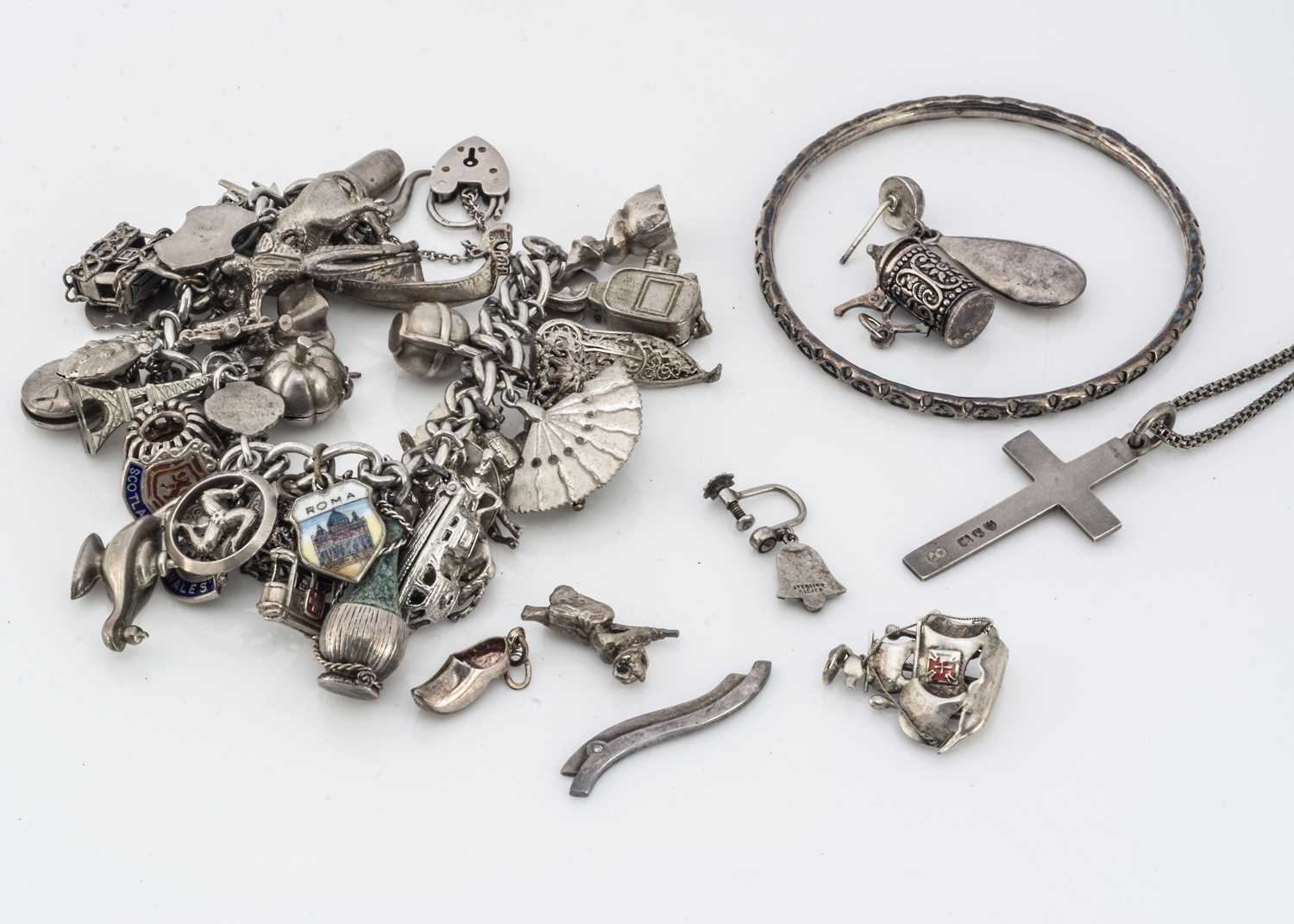 Lot 106 - A silver charm braclet