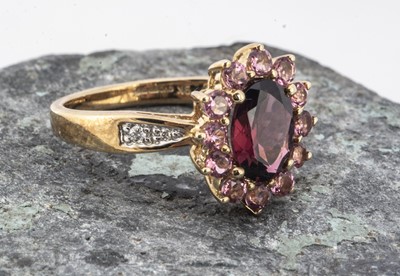 Lot 119 - A contemporary 9ct gold 9ct gold QVC garnet and amethyst diamond set shoulder cluster ring