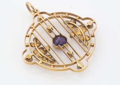Lot 145 - An Edwardian 15ct gold amethyst and seed pearl circular openwork pendant