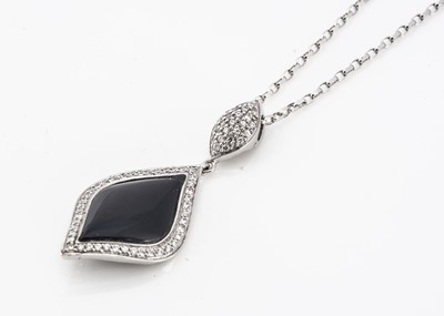 Lot 204 - A contemporary 9ct gold enamel and diamond pendant
