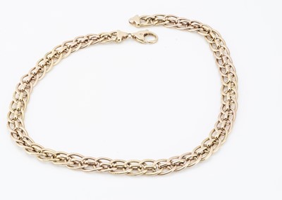 Lot 206 - An Italian 18ct gold curb link and textured chain