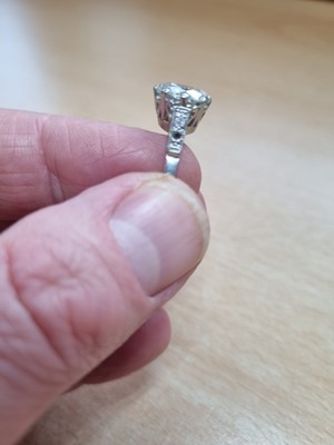 Lot 231 - A diamond solitaire platinum set ring