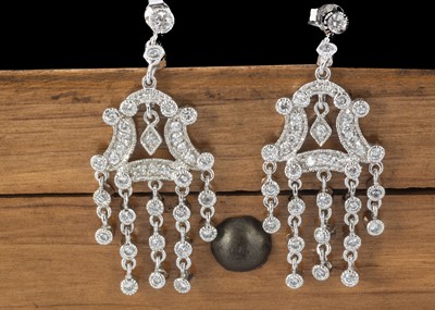 Lot 232 - A pair of cz and silver chandelier drop earrings