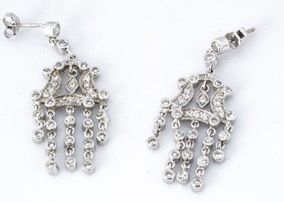 Lot 232 - A pair of cz and silver chandelier drop earrings