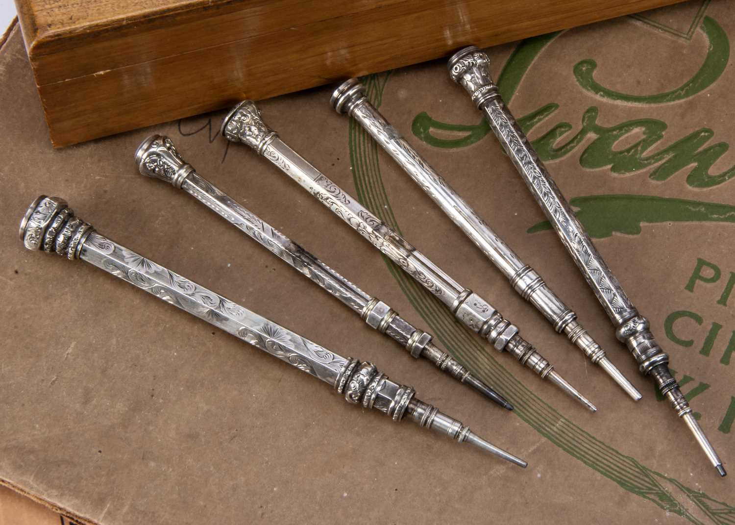 Lot 250 - Five Victorian silver and white metal retractable pencils