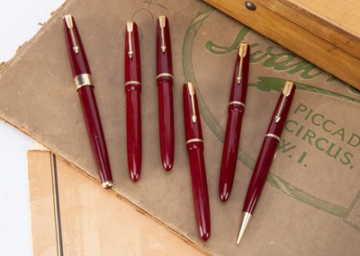 Lot 253 - Six  Red Parker fountain pens