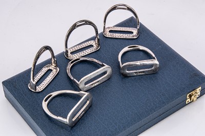 Lot 266 - A set of six 1980s silver novelty napkin rings from Garrard & Co