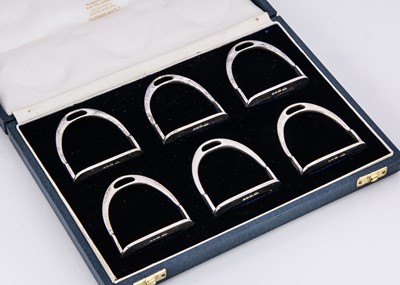 Lot 266 - A set of six 1980s silver novelty napkin rings from Garrard & Co