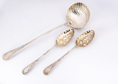 Lot 283 - A George III silver soup ladle and a pair of Victorian silver berry spoons
