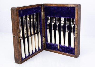 Lot 294 - A cased George V period set of six silver and mother of pearl handled dessert knives and forks by Henry Wilkinson