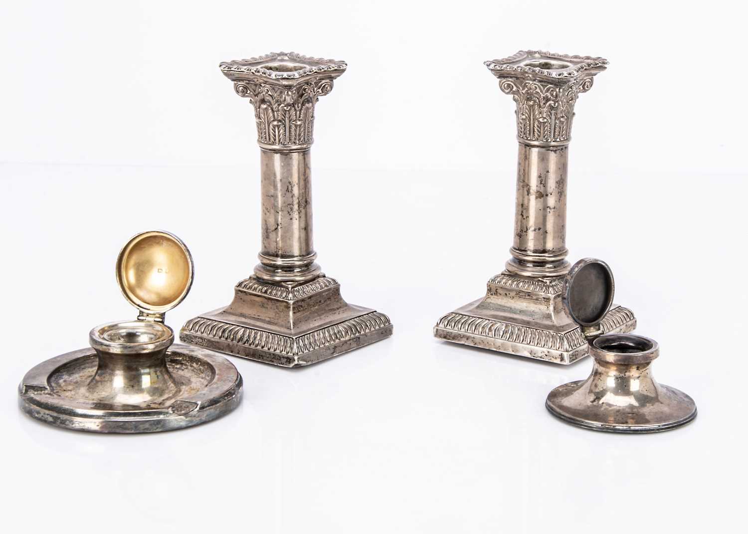 Lot 299 - A pair of Victorian silver filled column candlesticks