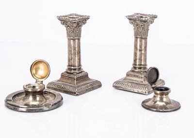 Lot 299 - A pair of Victorian silver filled column candlesticks
