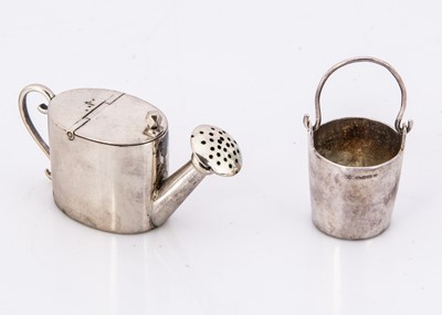 Lot 318 - Two miniature silver dolls' house gardening items
