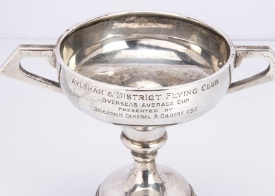 Lot 330 - A George V silver presentation twin-handled trophy with weighted base