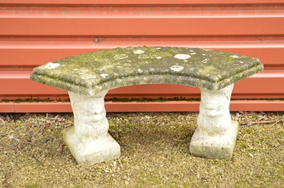 Lot 355 - A carved stone and concrete bench