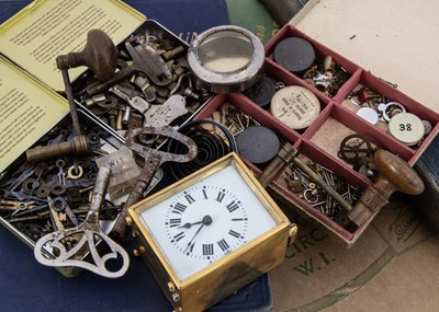 Lot 8 - A collection of clock and watch spare parts and related items