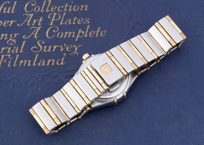 Lot 94 - A modern Omega Constellation quarts stainless steel and gold lady's wristwatch