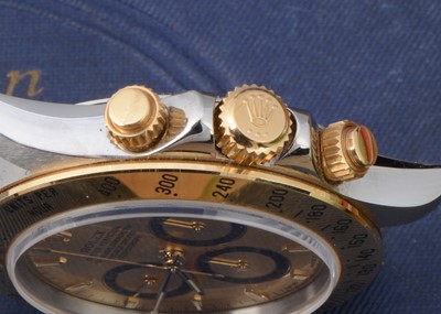 Lot 106 - A 1990s Rolex Oyster Perpetual Daytona stainless steel and 18ct gold wristwatch full set