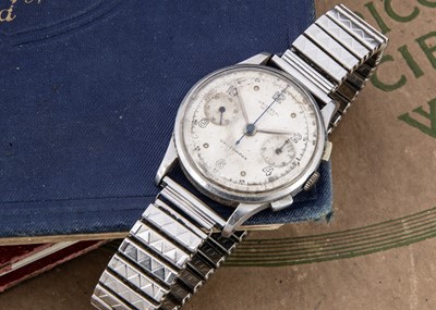 Lot 140 - A circa 1950 Universal Uni-dash Compact manual wind stainless steel wristwatch