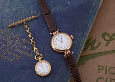 Lot 192 - A vintage 9ct gold cased lady's wristwatch and a gold plated nurse's watch on a 9ct gold support