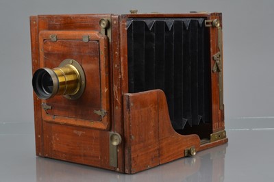 Lot 40 - A Mahogany and Brass Half Plate Tailboard Camera