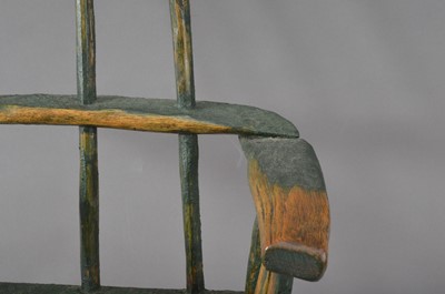 Lot 382 - A 19th century primitive elm stick back child's armchair