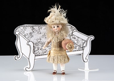 Lot 17 - A fine Simon & Halbig Mignonette all-bisque swivel head dolls’ house doll